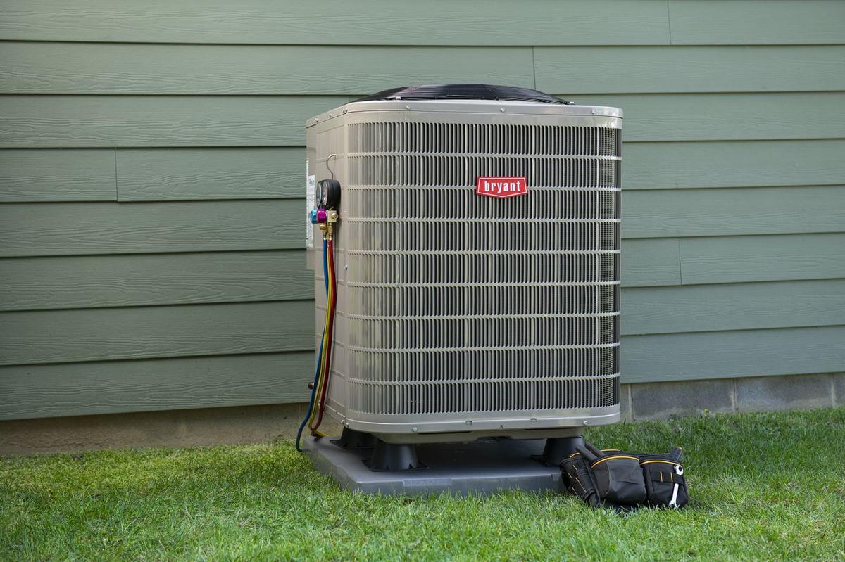 Bryant HVAC outdoor unit with service gauges during a Warrior Heating & Cooling visit